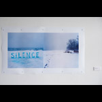 Image of two winter scenes, the left image with white ice letters SILENCE right image tracks in snow with trees