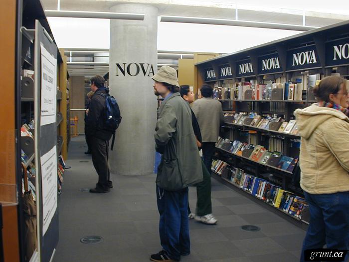 2005 10 17 Hans Winkler Nova Reading Room installation view Jeremy Turner perusing shelves